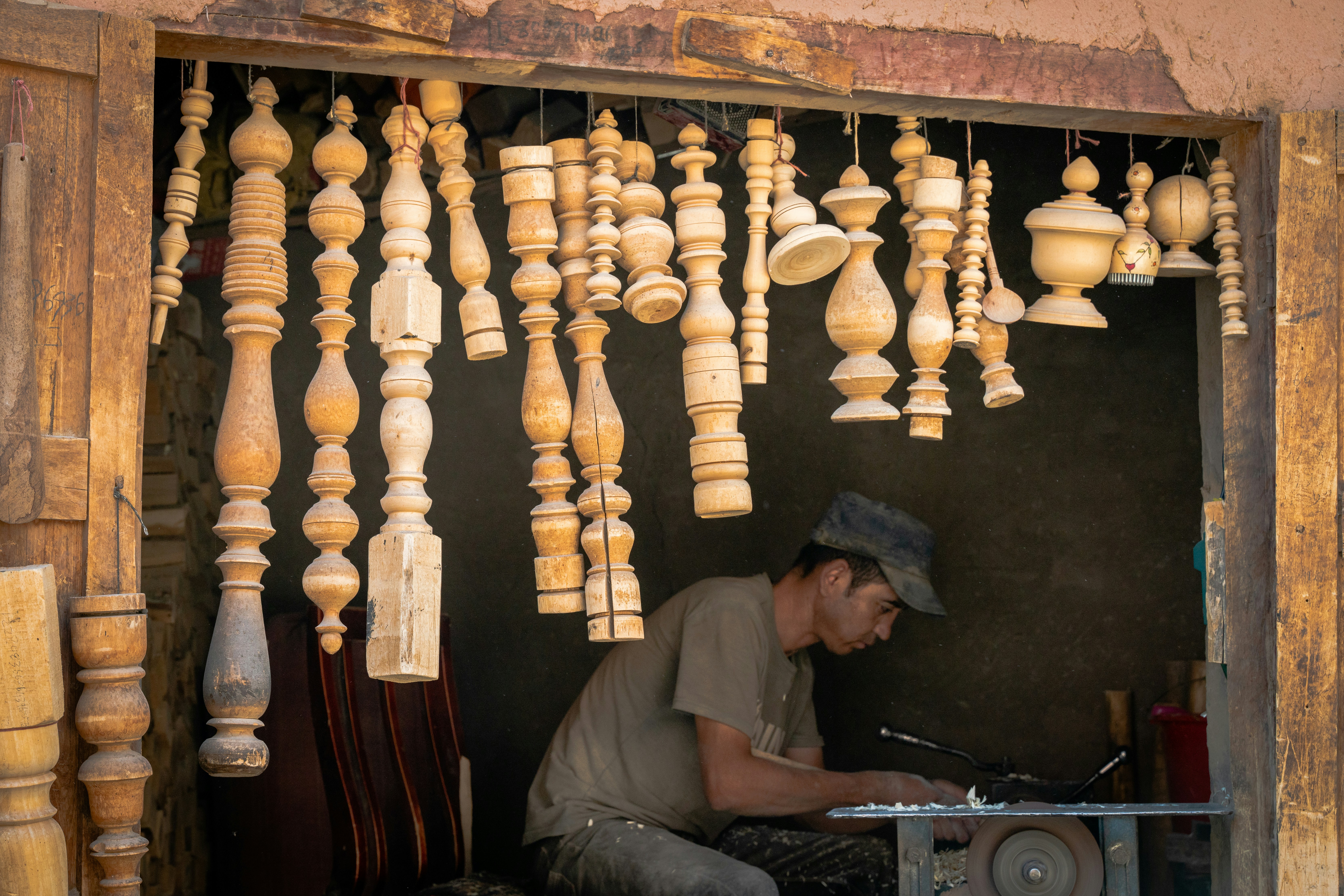 Professional woodworking craftsmanship with elegant natural light highlighting artisan expertise